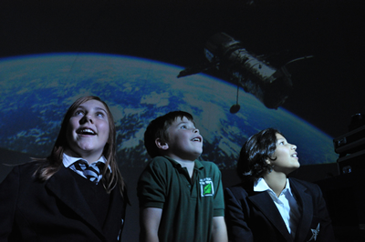 Children inside the planetarium