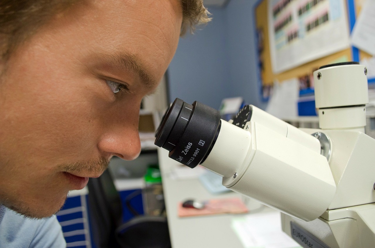 Man looking into a microscope