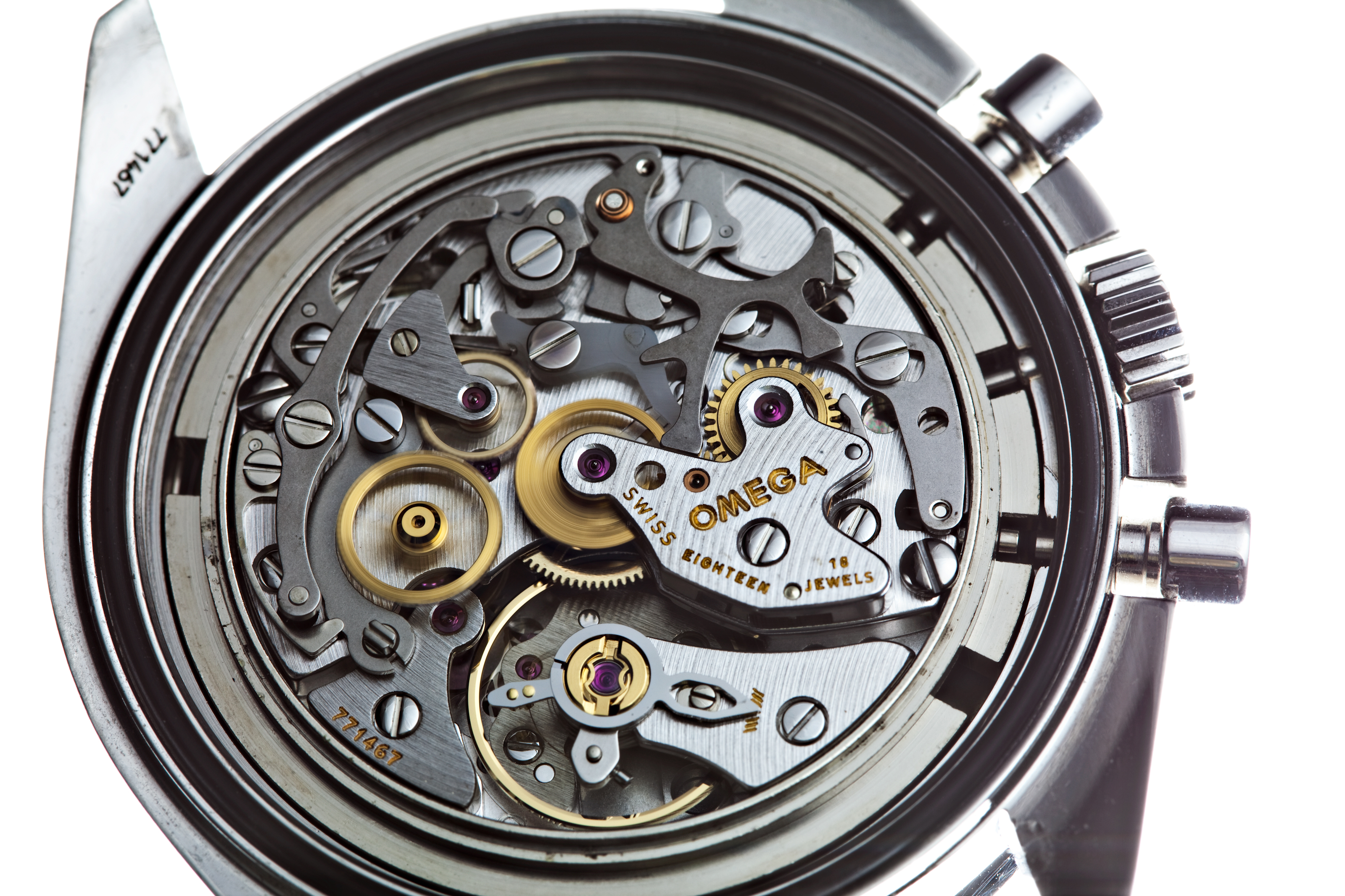 An OMEGA watch with its back open displaying the mechanisms