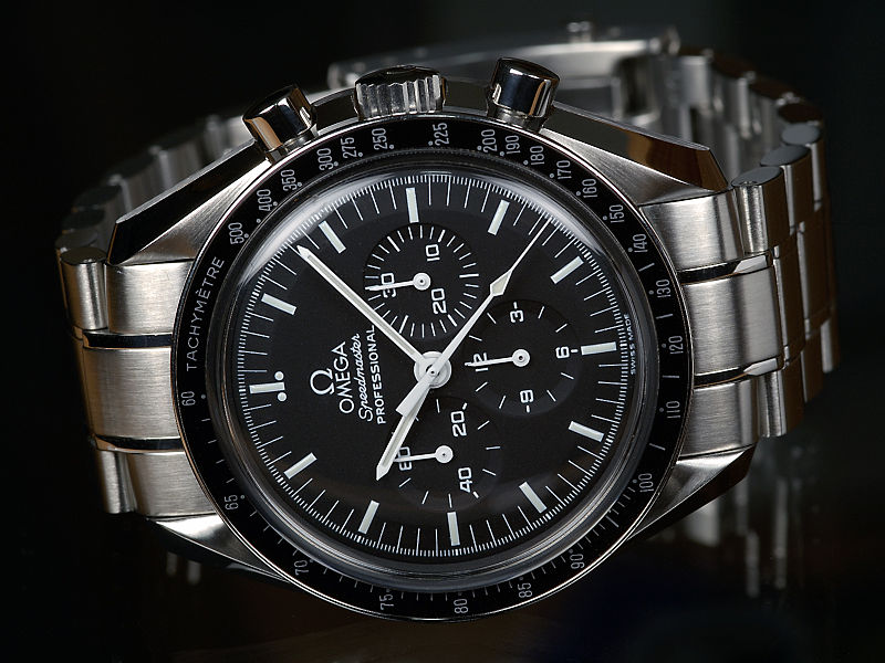 Omega speedmaster watch on black background